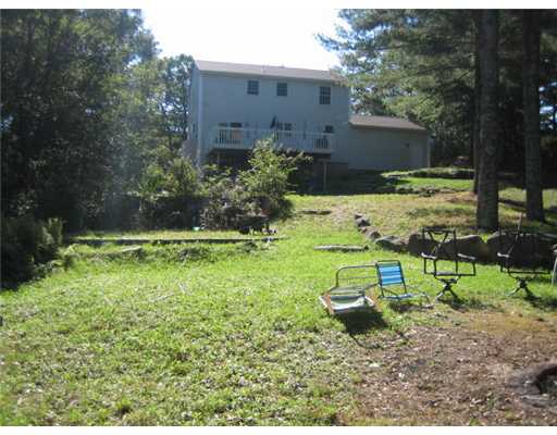 25 Dolly Pond Road Exeter, RI 02822 - Photo 4 of 14 Exterior Back. Lot slops down to the pond.