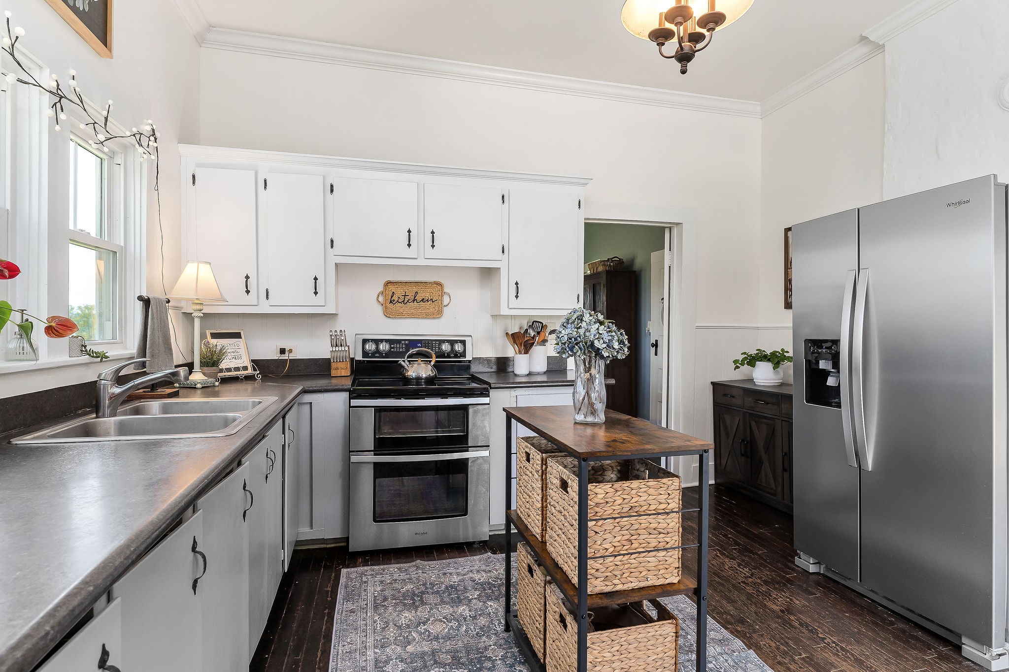77 McAfee Lane Morrison, TN 37357 - Photo 18 of 39 a kitchen with cabinets wooden floor and stainless steel appliances