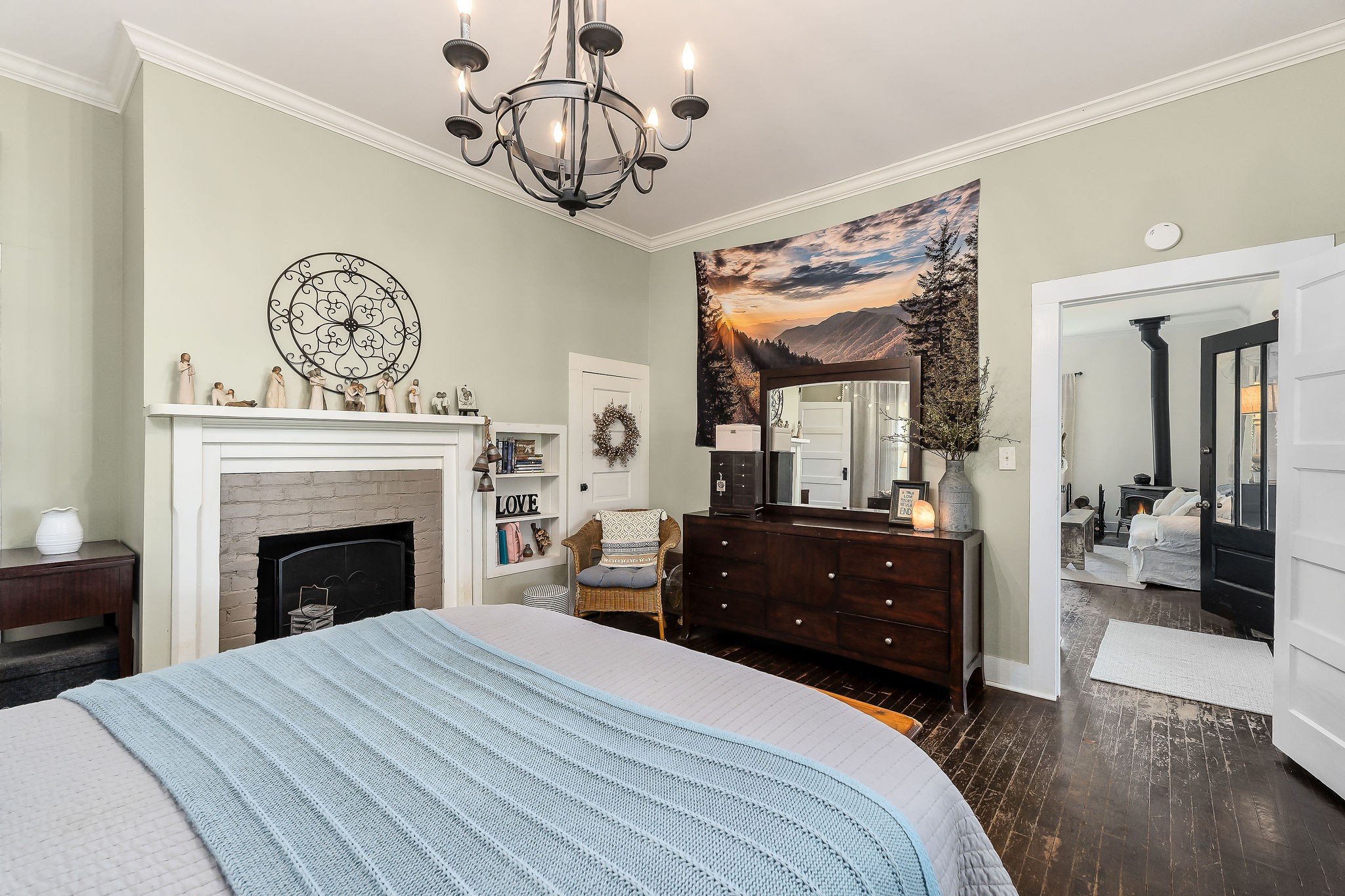 77 McAfee Lane Morrison, TN 37357 - Photo 25 of 39 a bedroom with a bed and a chandelier