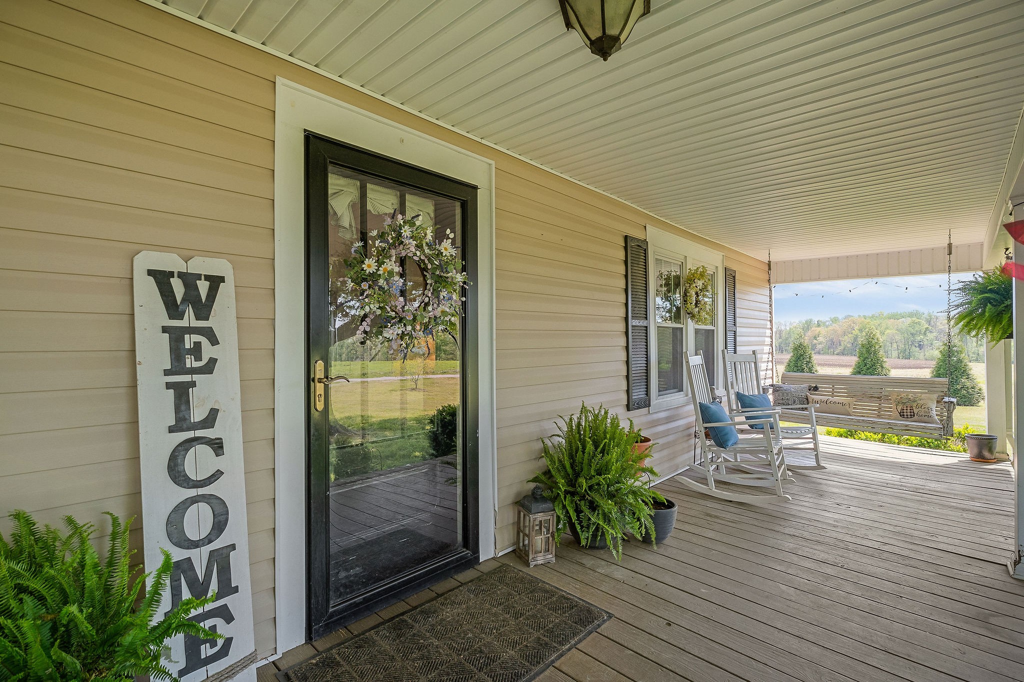77 McAfee Lane Morrison, TN 37357 - Photo 5 of 39 a porch with seating space and garden