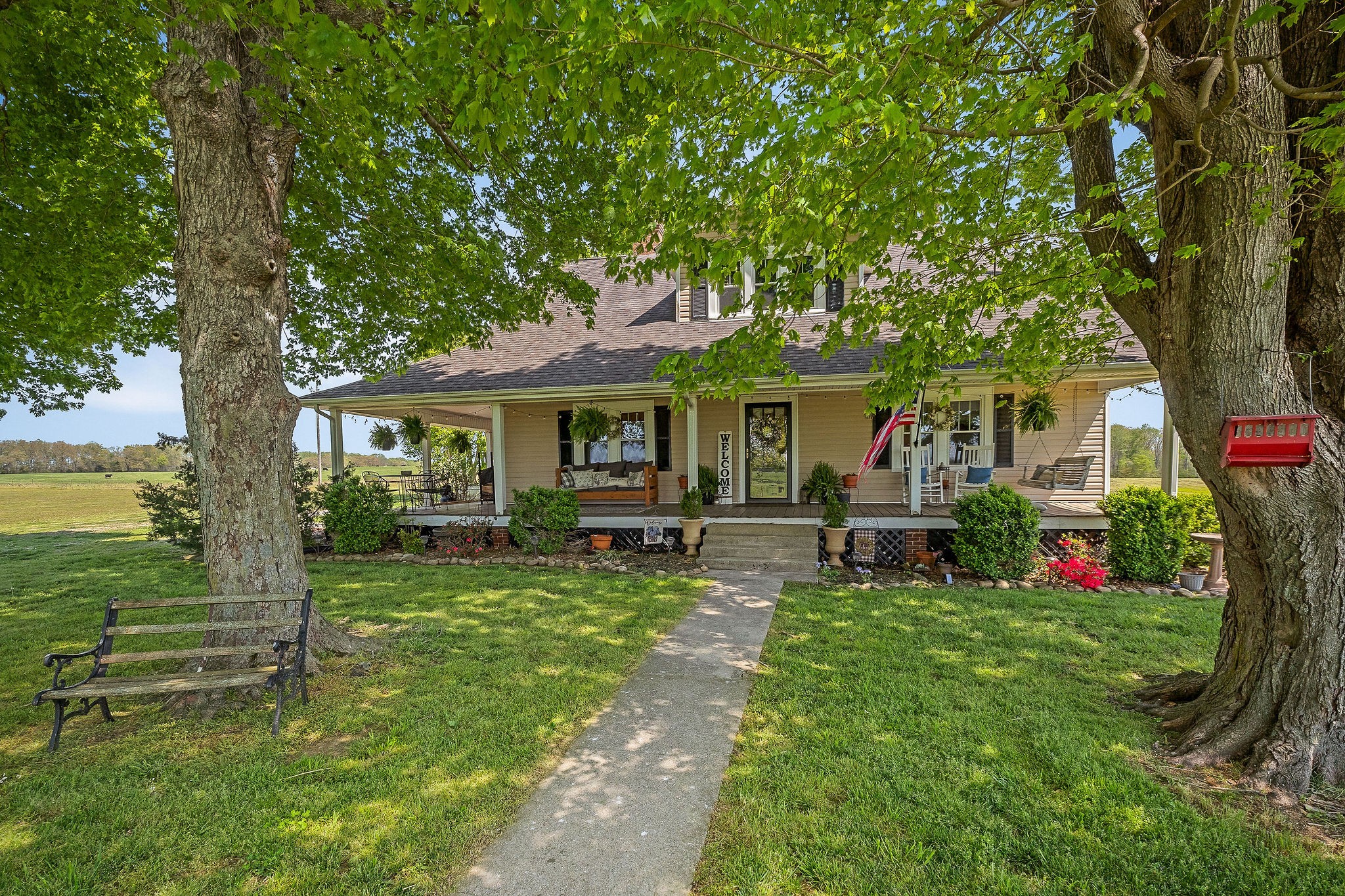 77 McAfee Lane Morrison, TN 37357 - Photo 7 of 39 a view of a house with backyard sitting area and garden