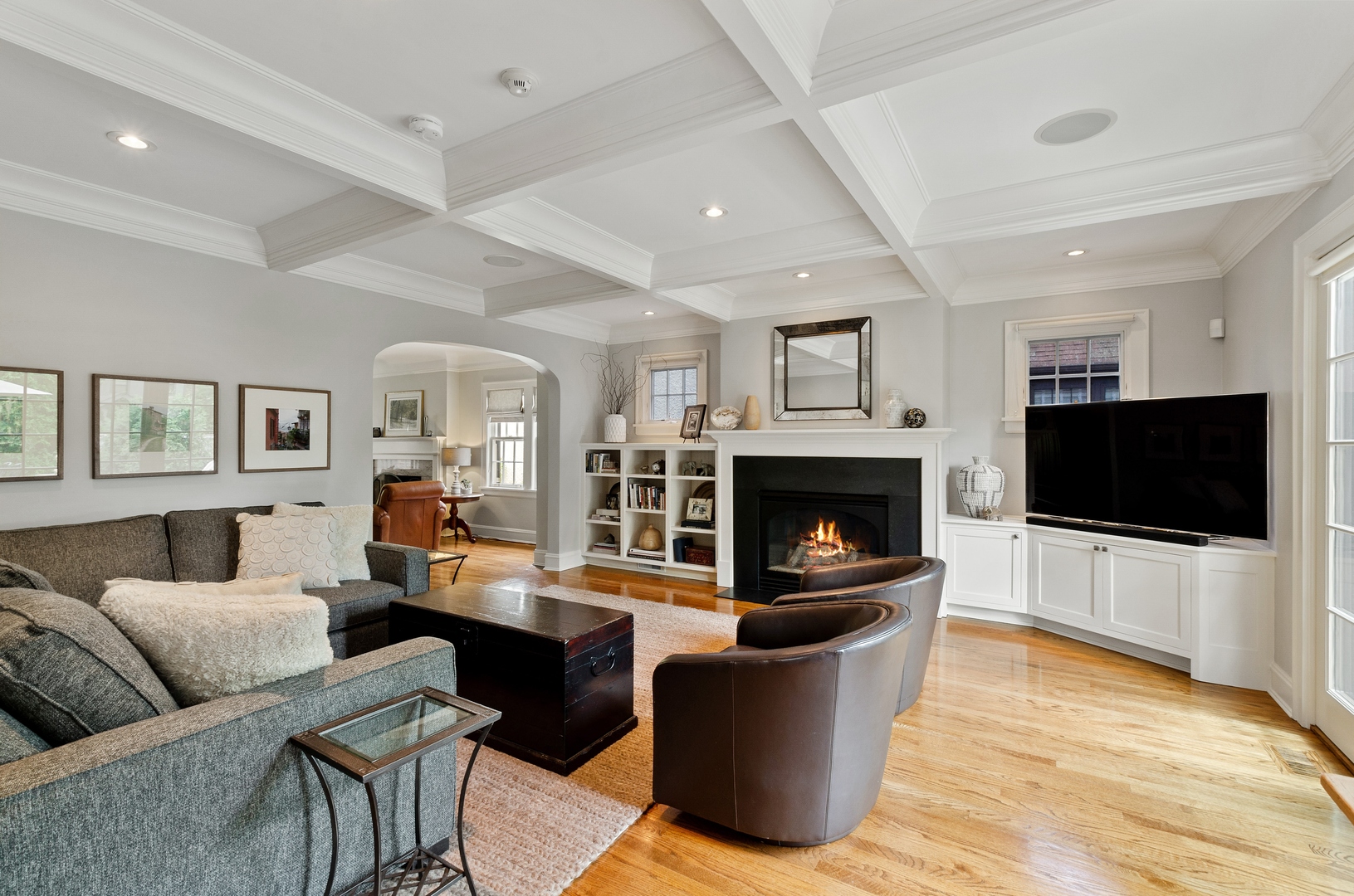 514 Meadow Road Winnetka, IL 60093 - Photo 11 of 31 a living room with furniture a flat screen tv and a fireplace