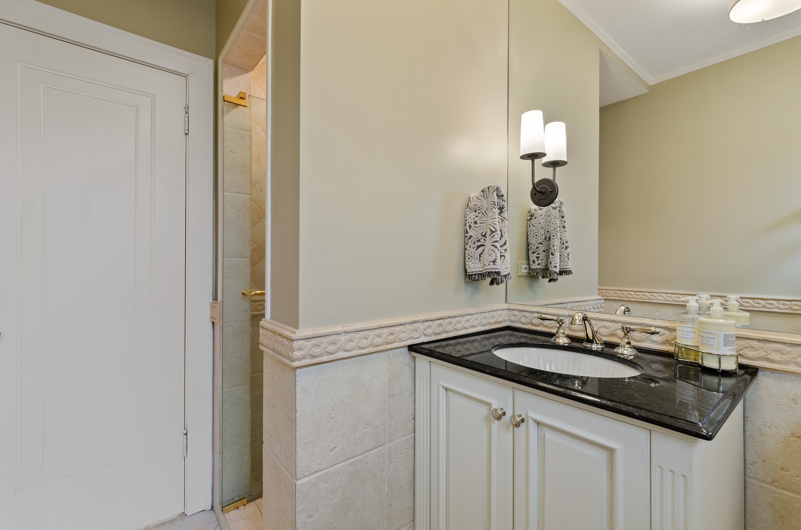 514 Meadow Road Winnetka, IL 60093 - Photo 14 of 31 a bathroom with a sink and a mirror