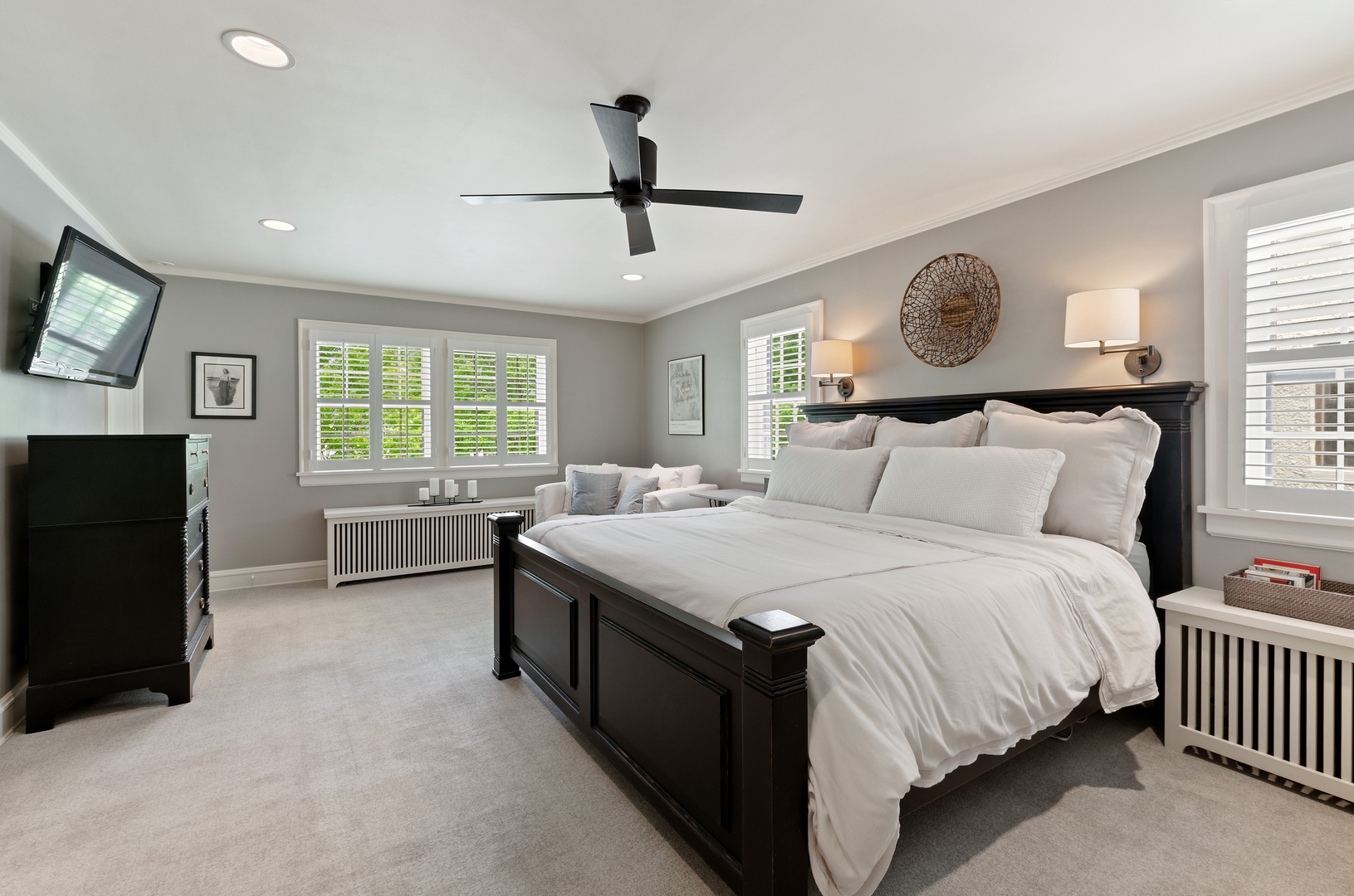 514 Meadow Road Winnetka, IL 60093 - Photo 16 of 31 a bedroom with a bed and a chandelier