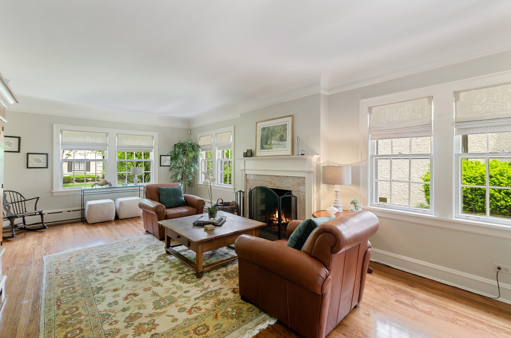 514 Meadow Road Winnetka, IL 60093 - Photo 3 of 31 a living room with furniture and a fireplace