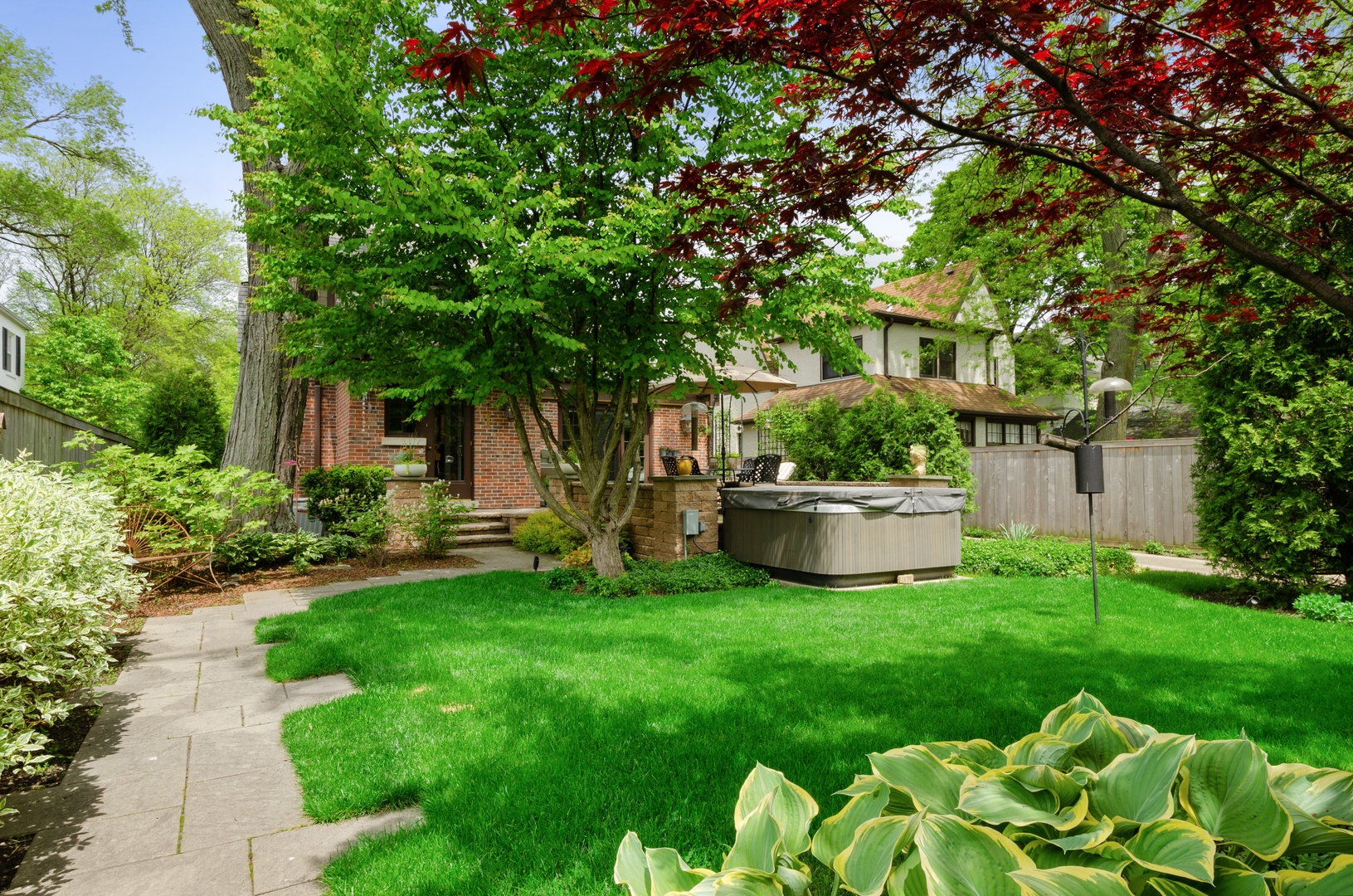 514 Meadow Road Winnetka, IL 60093 - Photo 26 of 31 a view of a house with a yard and sitting area