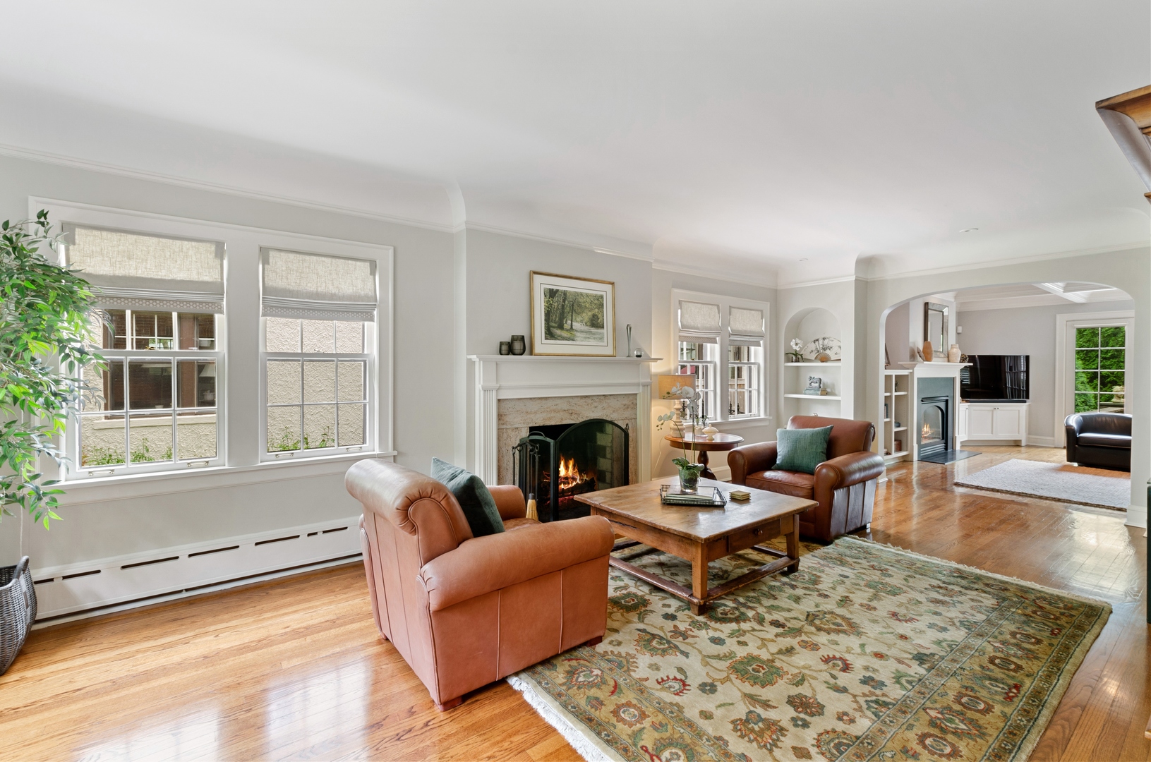 514 Meadow Road Winnetka, IL 60093 - Photo 4 of 31 a living room with furniture and a fireplace