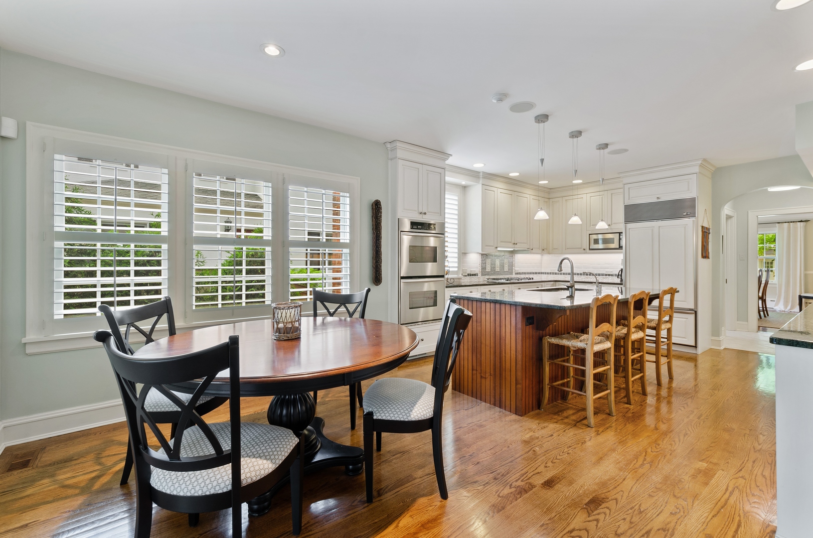 514 Meadow Road Winnetka, IL 60093 - Photo 6 of 31 a dining room with furniture and wooden floor