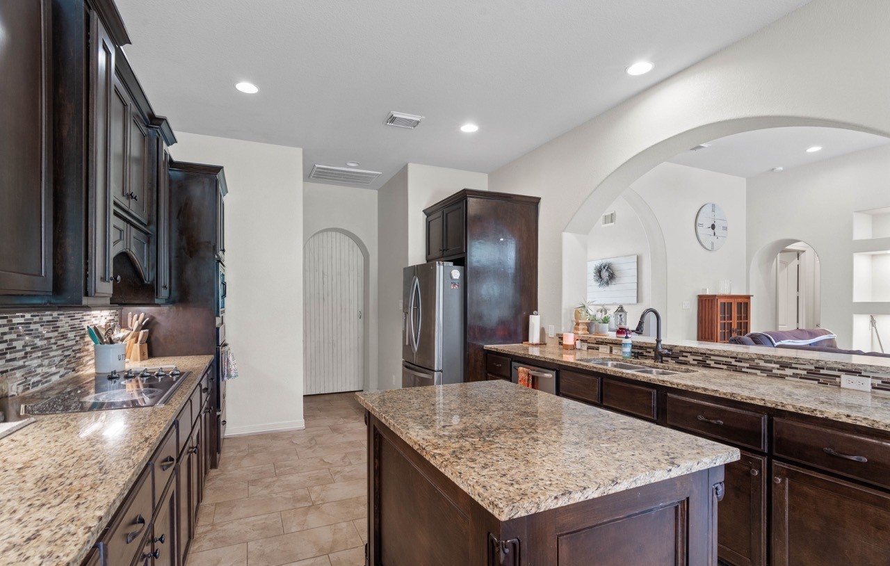 27585 Rio Blanco Drive Splendora, TX 77372 - Photo 12 of 39 Another view of this great kitchen! The white door straight back leads to the formal dining room. Such an open space!