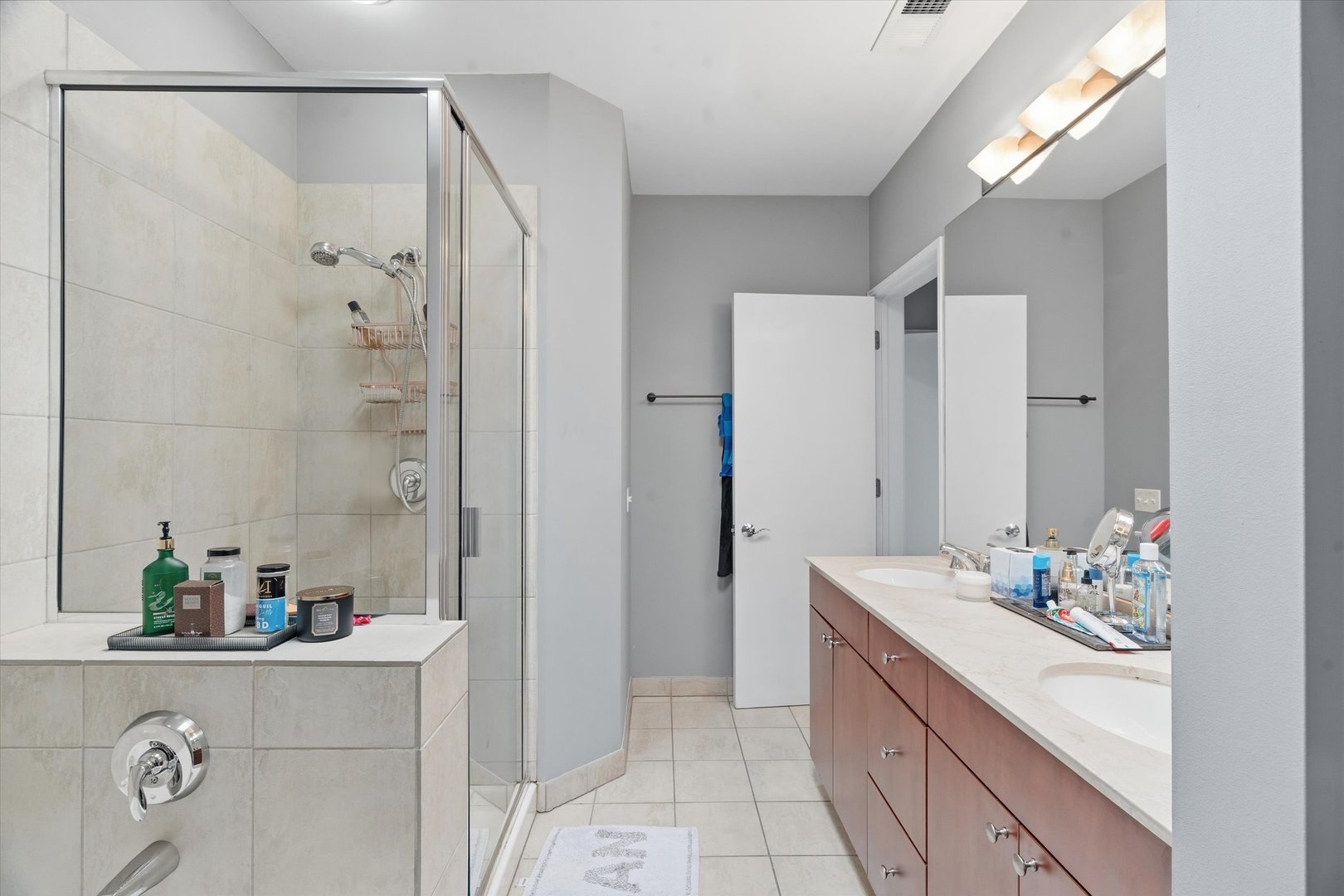648 West 16th Street, Unit 2 Chicago, IL 60616 - Photo 2 of 19 a bathroom with a mirror sink and shower