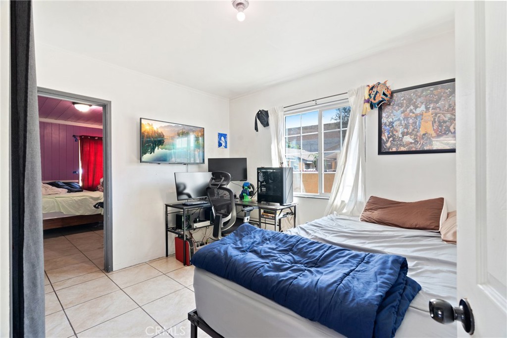 4633 Leonis Street Commerce, CA 90040 - Photo 14 of 30 a bedroom with furniture and a window