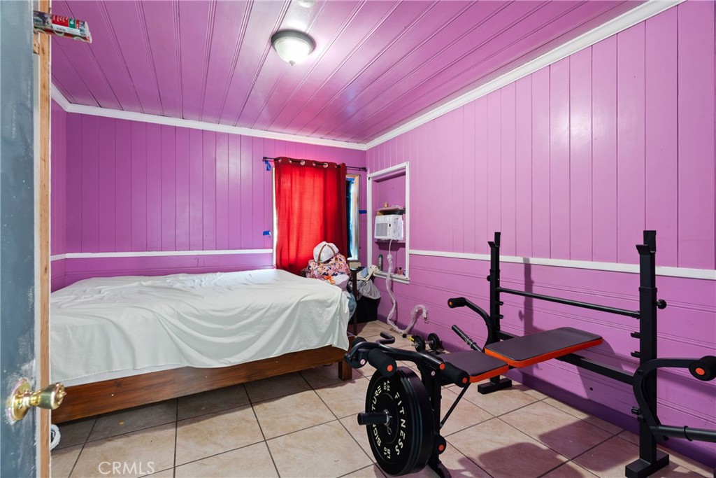 4633 Leonis Street Commerce, CA 90040 - Photo 16 of 30 a bed room with a bed and a table