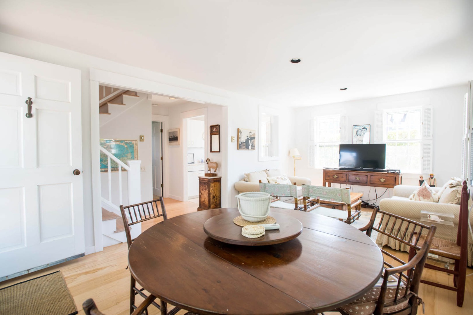 33 Cliff Road Nantucket, MA 02554 - Photo 58 of 84 a living room with furniture kitchen view and a wooden floor