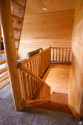15253 Mill Road, Unit 62 Huntsville, UT 84317 - Photo 31 of 48 Rustic staircase featuring log-style railings and banisters