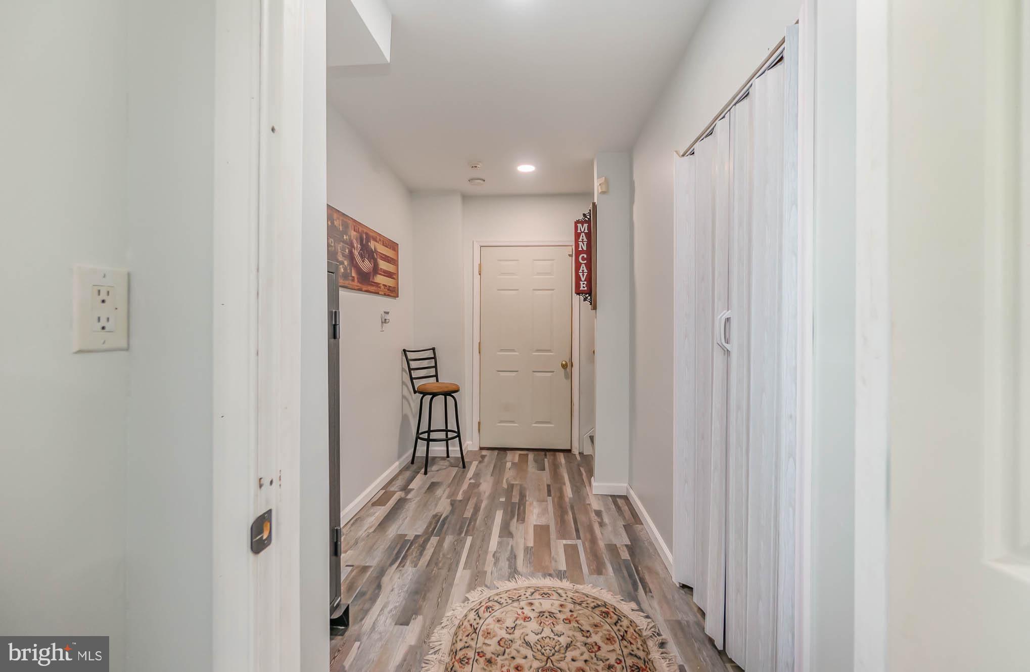 827 Seneca Park Road Middle River, MD 21220 - Photo 42 of 49 Lower Level Hallway leading to 2 Car Garage