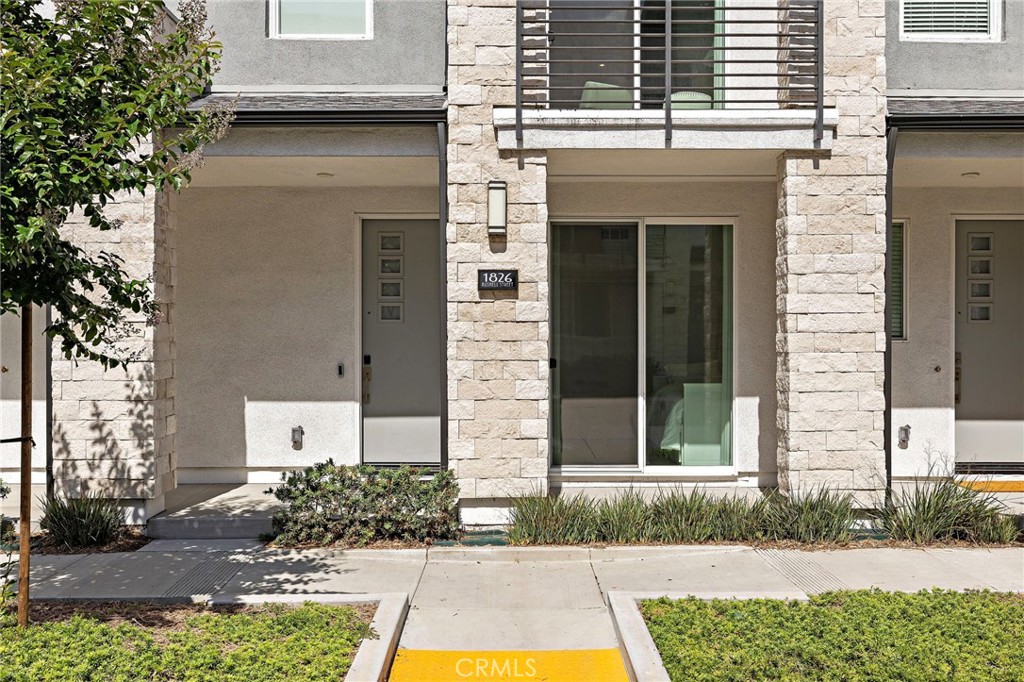 1826 West Bushell Street Anaheim, CA 92805 - Photo 3 of 30 a front view of a house with a yard