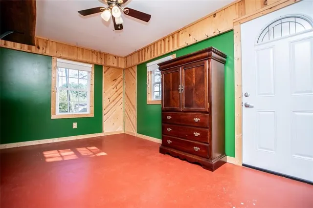 a view of a house with a yard patio and fire pit