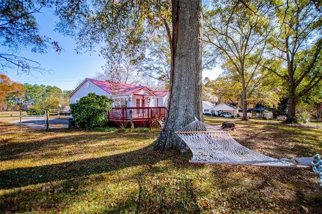 a kitchen with cabinets appliances a sink and a window