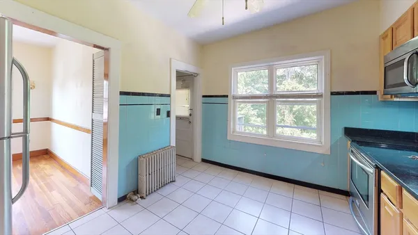 a view of a kitchen from the hallway