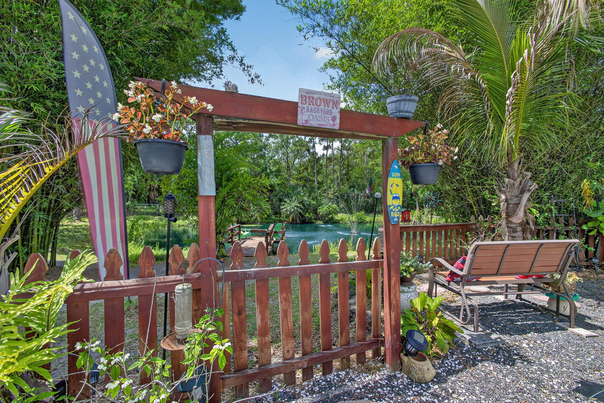 12558 165th Road North Jupiter, FL 33478 - Photo 47 of 67 a view of a chairs and table in the backyard