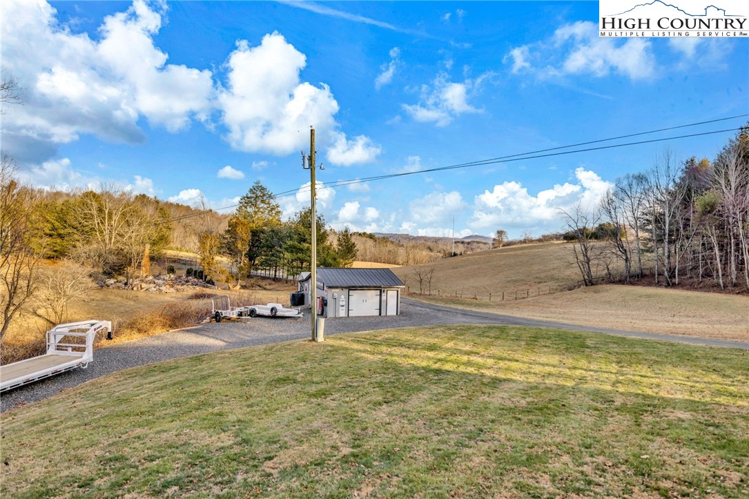747 Nathans Creek School Road Crumpler, NC 28617 - Photo 40 of 42 a view of a swimming pool with an outdoor seating