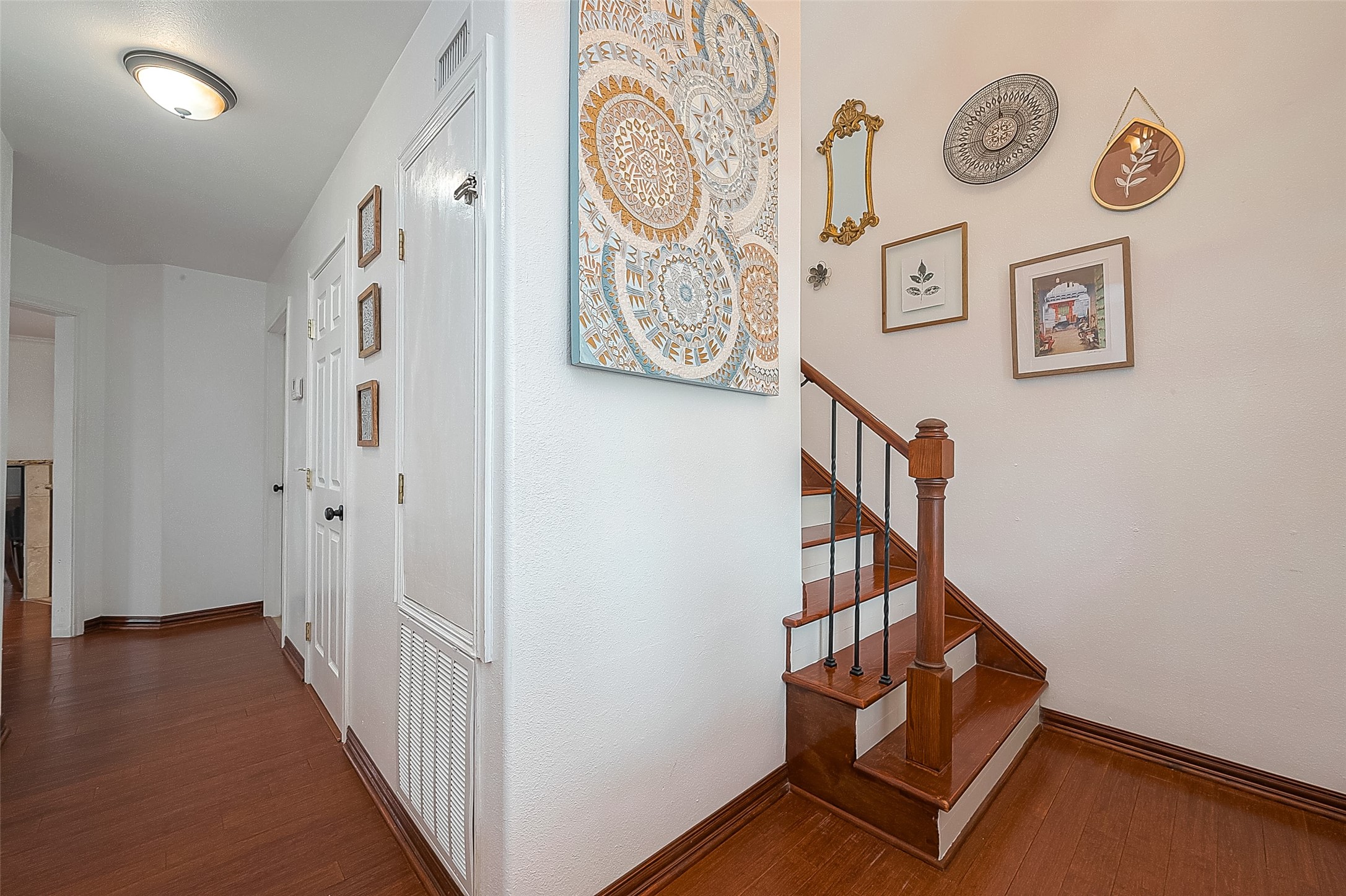 6703 Winton Street Houston, TX 77021 - Photo 4 of 49 Foyer with hallway leading to half bath and living space, plus staircase to the upstairs