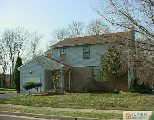 3 Churchill Road Edison, NJ 08820 - Photo 1 of 8 a view of a house with a yard