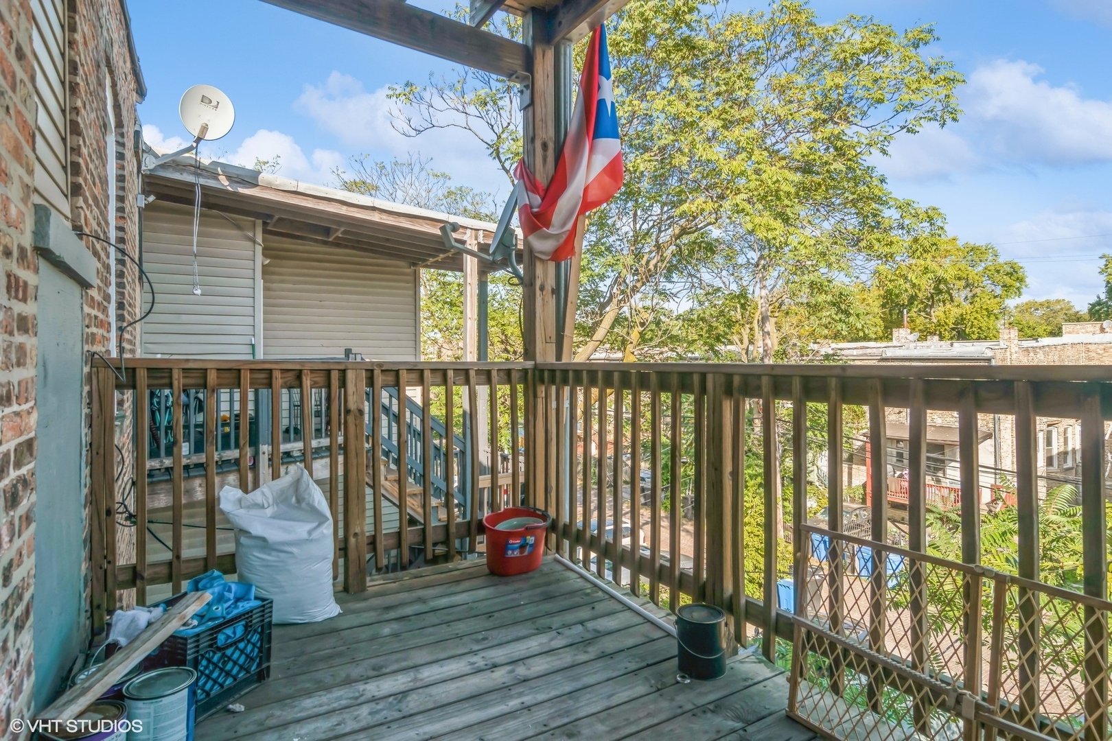 3404-06 West Walnut Street Chicago, IL 60624 - Photo 11 of 11 a view of a balcony with chair and wooden floor