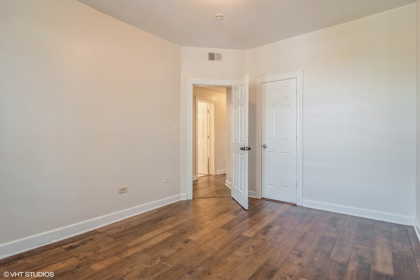3404-06 West Walnut Street Chicago, IL 60624 - Photo 5 of 11 a view of an empty room with wooden floor and closet