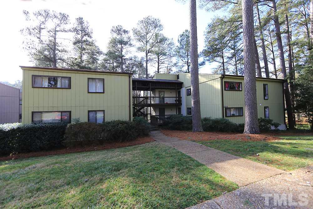 524 Pine Ridge Place, Unit 524 Raleigh, NC 27609 - Photo 1 of 12 a front view of a house with garden