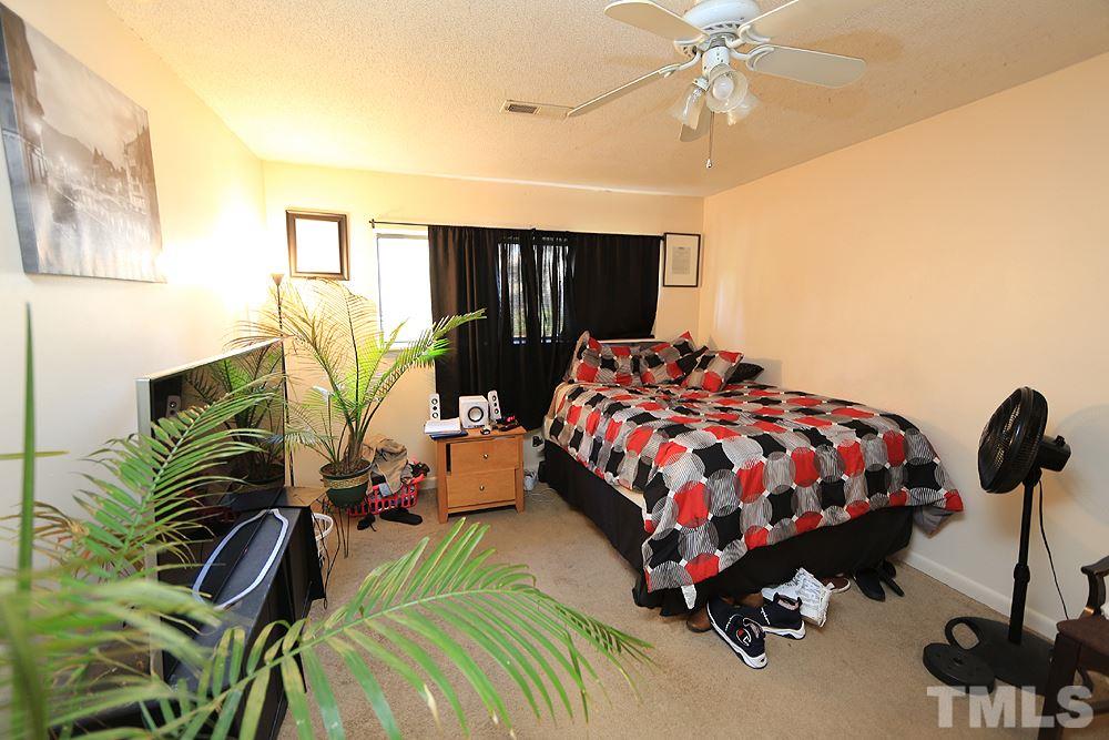 524 Pine Ridge Place, Unit 524 Raleigh, NC 27609 - Photo 9 of 12 a bedroom with bed and a window