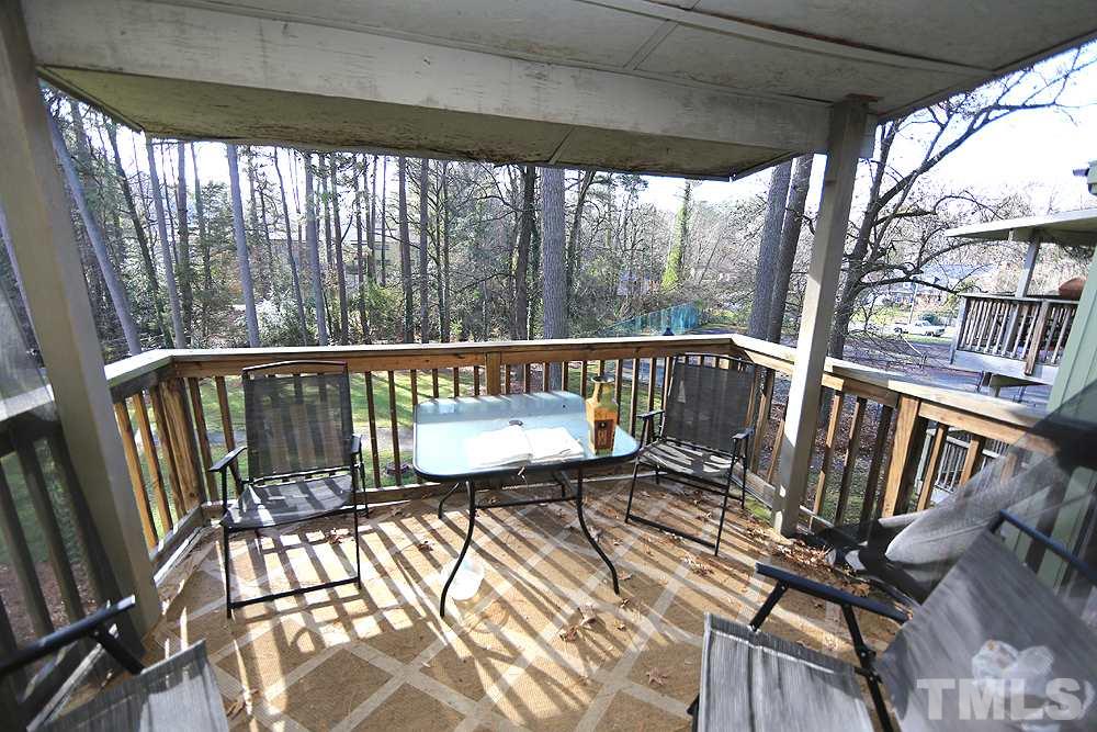 524 Pine Ridge Place, Unit 524 Raleigh, NC 27609 - Photo 10 of 12 a view of a balcony with wooden floor