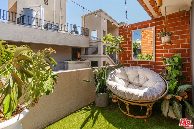 a view of an house with swimming pool porch and furniture