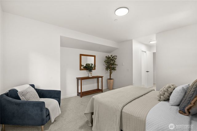 a bedroom with a bed and a couch