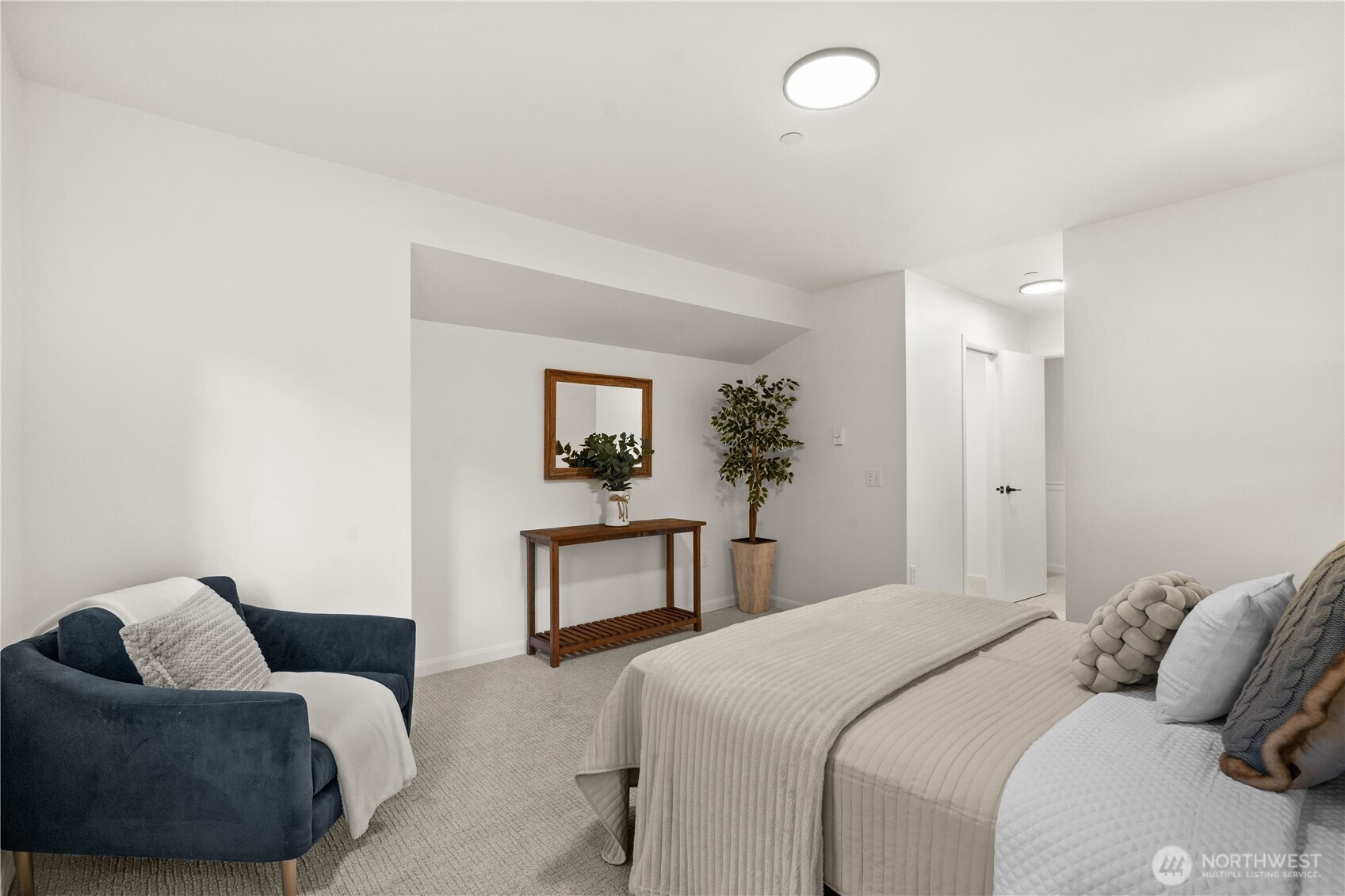 23210 Fitzgerald Road, Unit 2 Bothell, WA 98021 - Photo 13 of 26 a bedroom with a bed and a couch