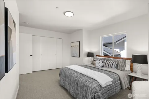 a bedroom with a bed and a night lamp