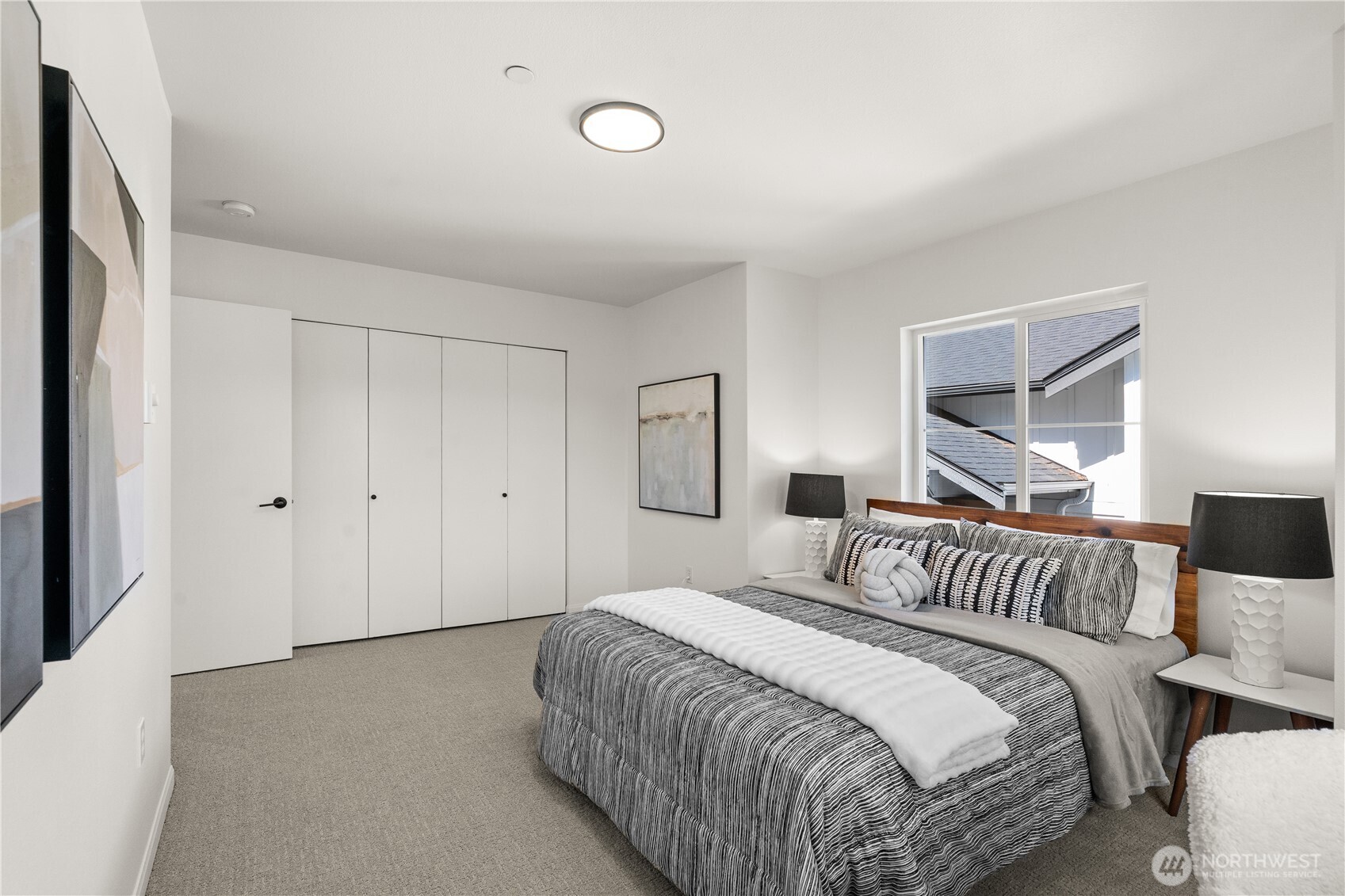 23210 Fitzgerald Road, Unit 2 Bothell, WA 98021 - Photo 16 of 26 a bedroom with a bed and a night lamp