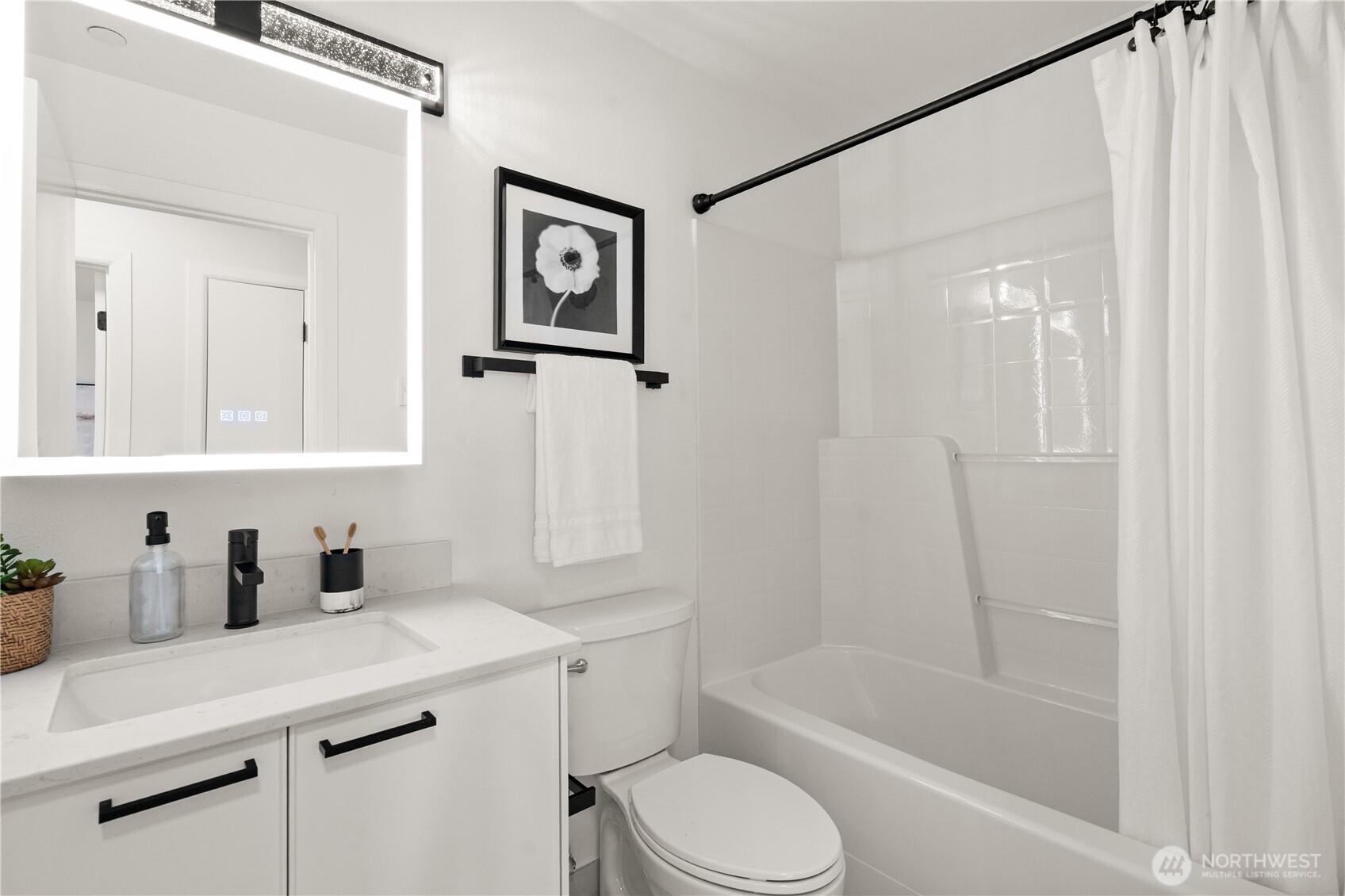 23210 Fitzgerald Road, Unit 2 Bothell, WA 98021 - Photo 17 of 26 a bathroom with a sink a toilet and shower