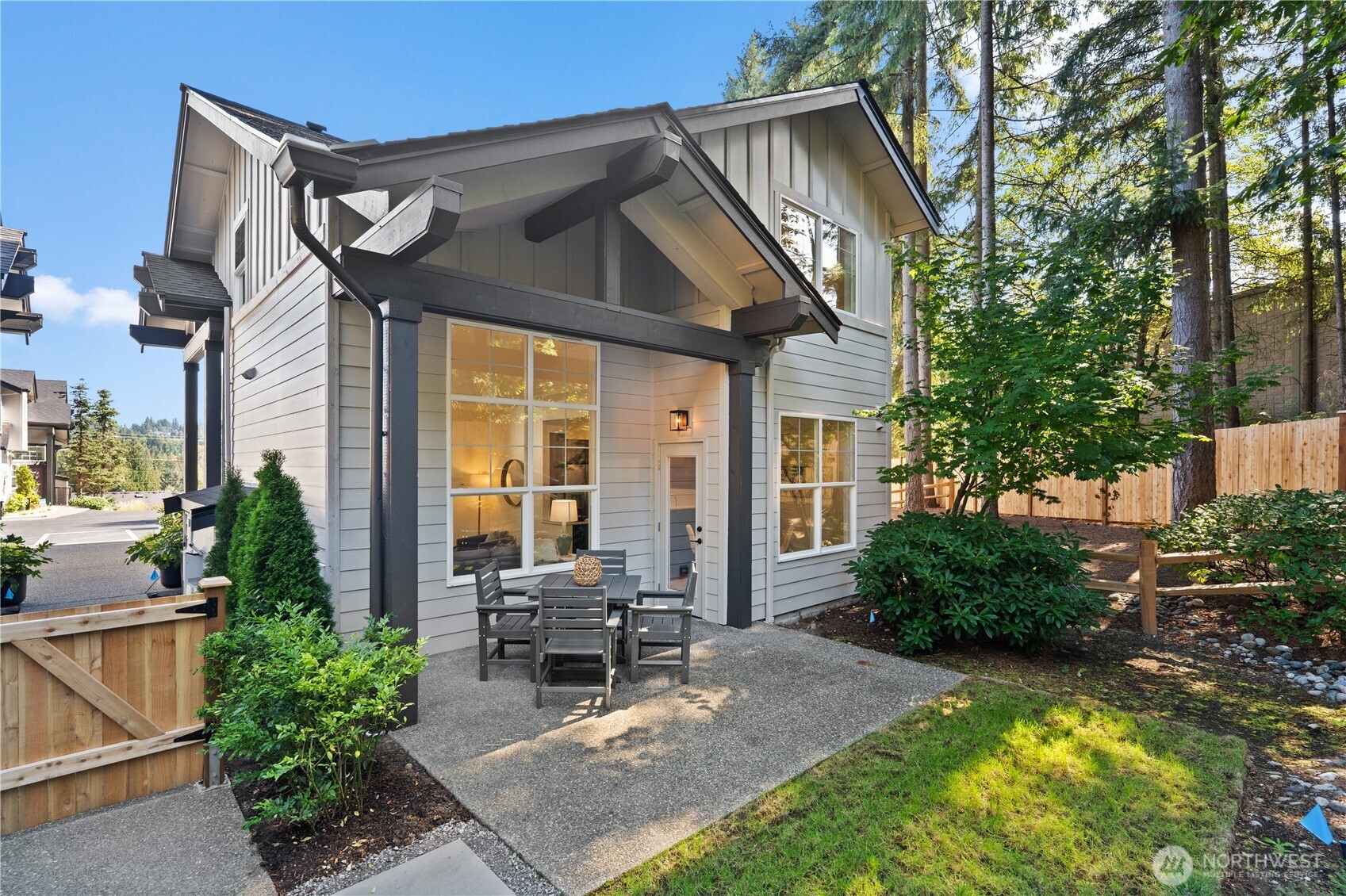 23210 Fitzgerald Road, Unit 2 Bothell, WA 98021 - Photo 23 of 26 a view of a chair and table in backyard of the house