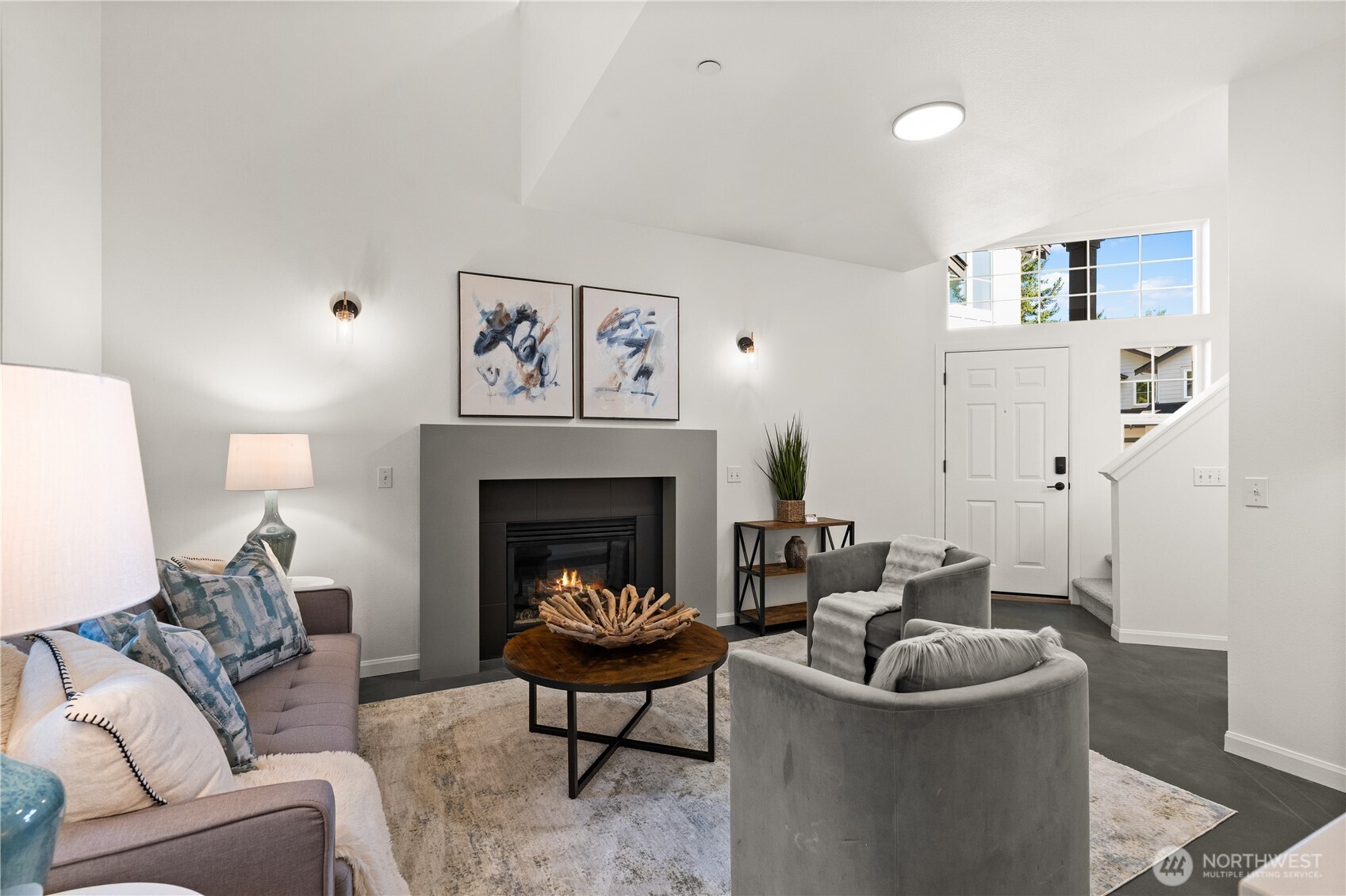 23210 Fitzgerald Road, Unit 2 Bothell, WA 98021 - Photo 3 of 26 a living room with furniture and a fireplace