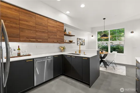 a kitchen with a sink and cabinets