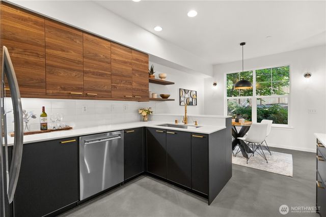 a kitchen with a sink and cabinets