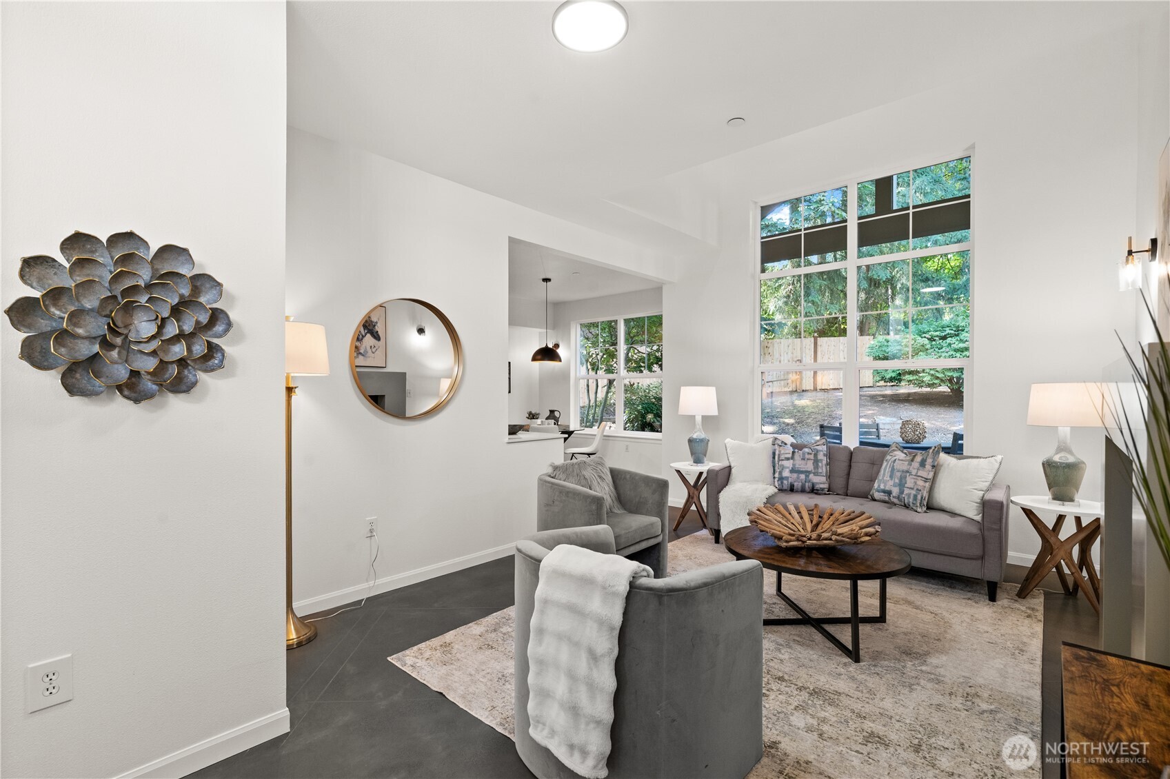 23210 Fitzgerald Road, Unit 2 Bothell, WA 98021 - Photo 7 of 26 a living room with furniture and a large window