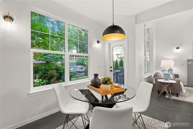 a living room with furniture fireplace and window