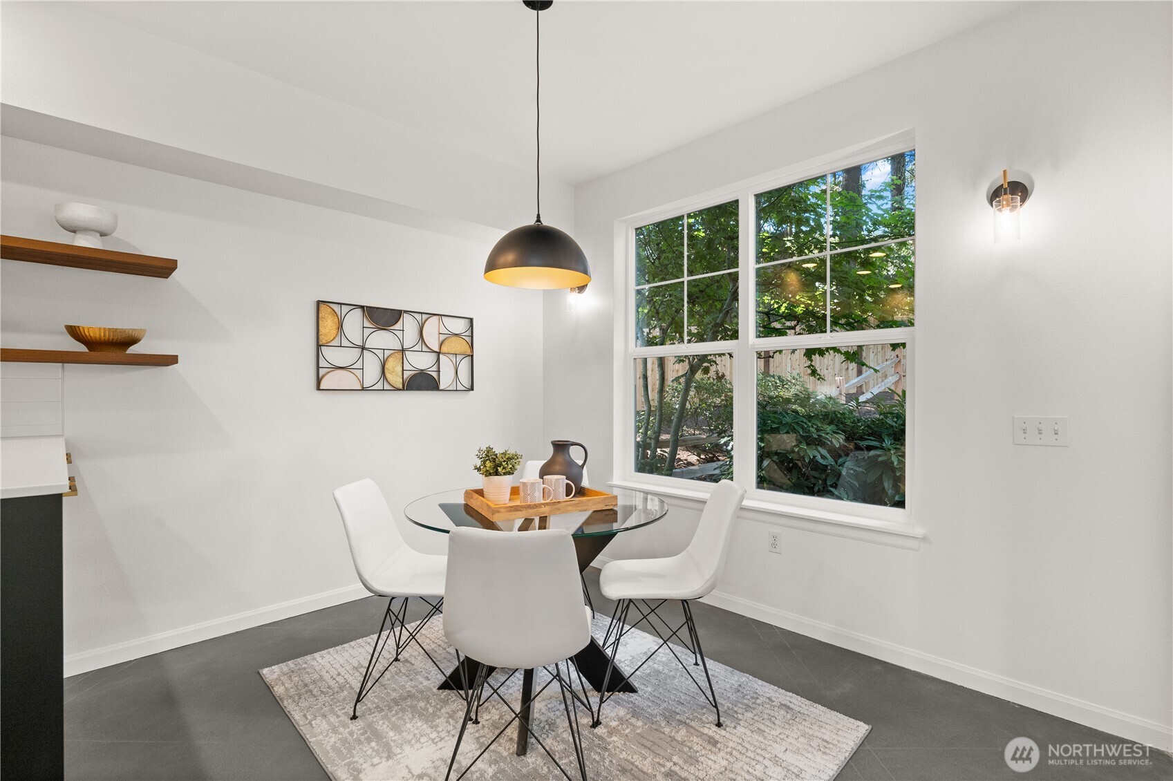 23210 Fitzgerald Road, Unit 2 Bothell, WA 98021 - Photo 10 of 26 a dining room with furniture a rug and a window