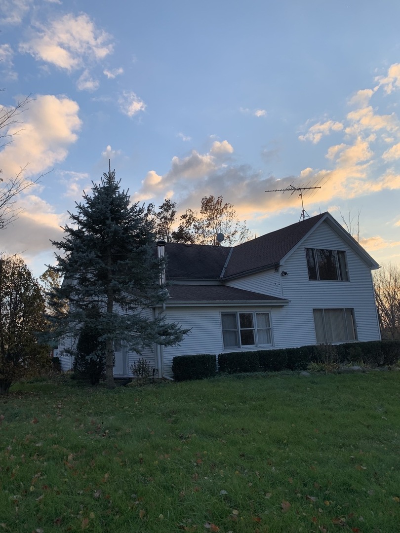 37W793 Binnie Road, Unit 1 Dundee, IL 60118 - Photo 19 of 23 a view of a yard in front of a house with a large tree