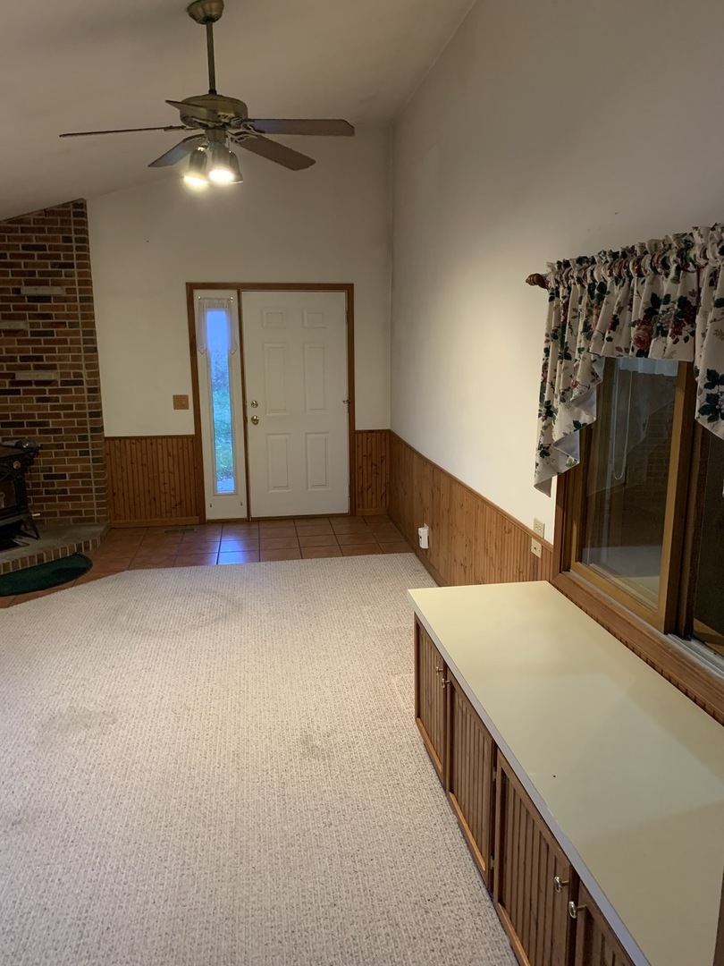 37W793 Binnie Road, Unit 1 Dundee, IL 60118 - Photo 3 of 23 a view of an empty room with window