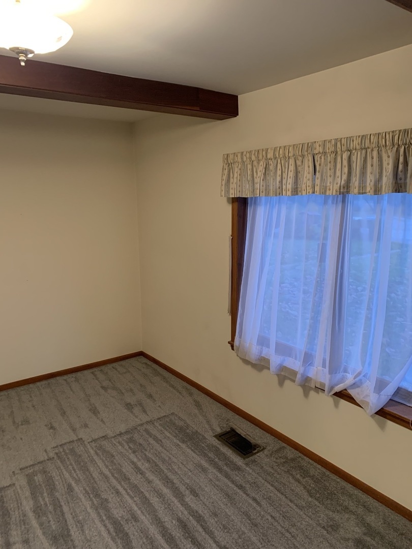 37W793 Binnie Road, Unit 1 Dundee, IL 60118 - Photo 10 of 23 a view of a room with wooden floor