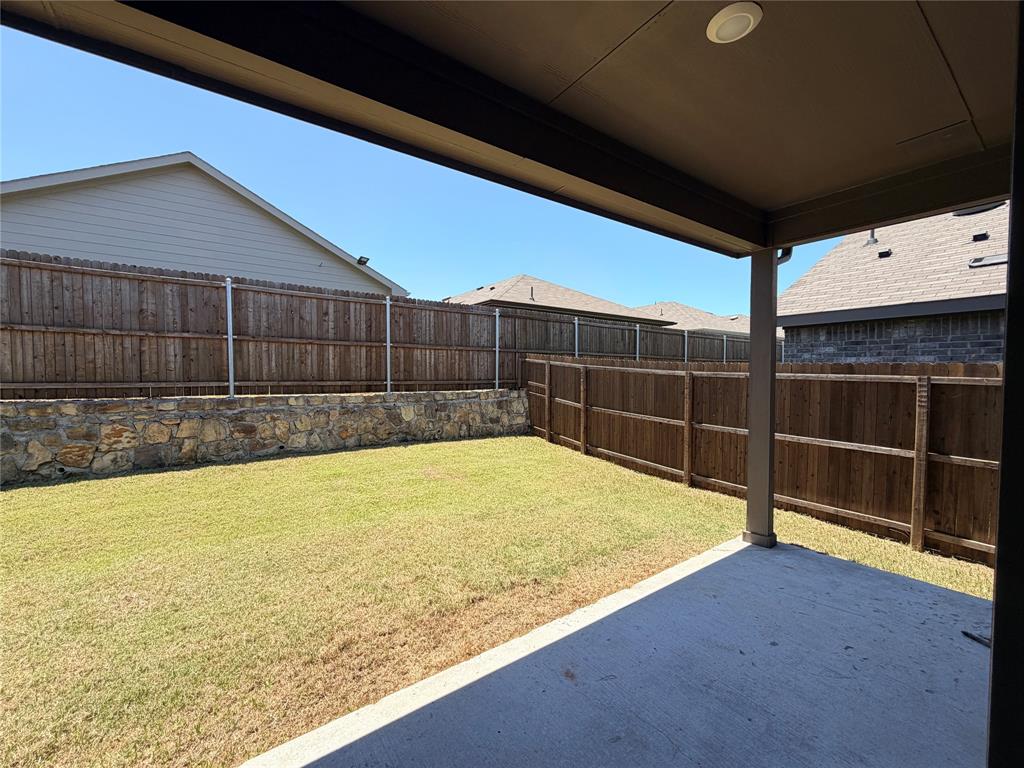 816 Country Road Royse City, TX 75189 - Photo 14 of 24 Covered patio with recessed lighting, concrete flooring, and an expansive lawn