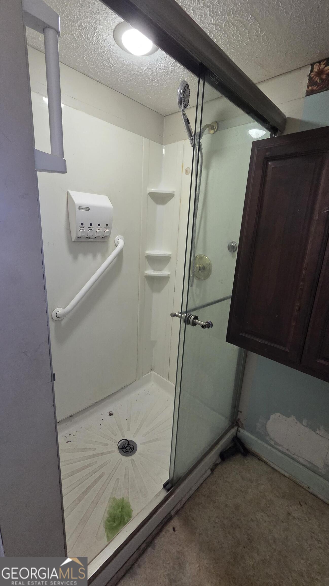 25 Fischer Road Sharpsburg, GA 30277 - Photo 11 of 22 a bathroom with a granite countertop sink a toilet and shower